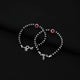 Stylish silver bracelet with a red evil eye and a mix of black and silver beads.