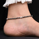 Stylish anklet with sterling silver and black beads for girls.