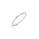 Elegant silver bangle featuring colorful gems with a simple white pattern.