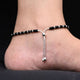 Silver anklet for girls with circle and heart design.