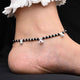 Stylish anklet with sterling silver, red gem stone, and black beads for girls.