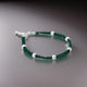 Elegant silver bracelet adorned with green beads for boys.